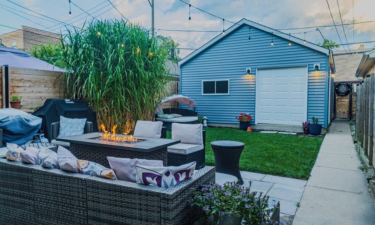 Logan Square Apartment | Modern 3-Bed Stay w/Patio, Firepit, & Garage Parking Spot
