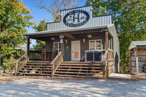 Bryant House | Mr Hills Mercantile Cabin with a hot tub