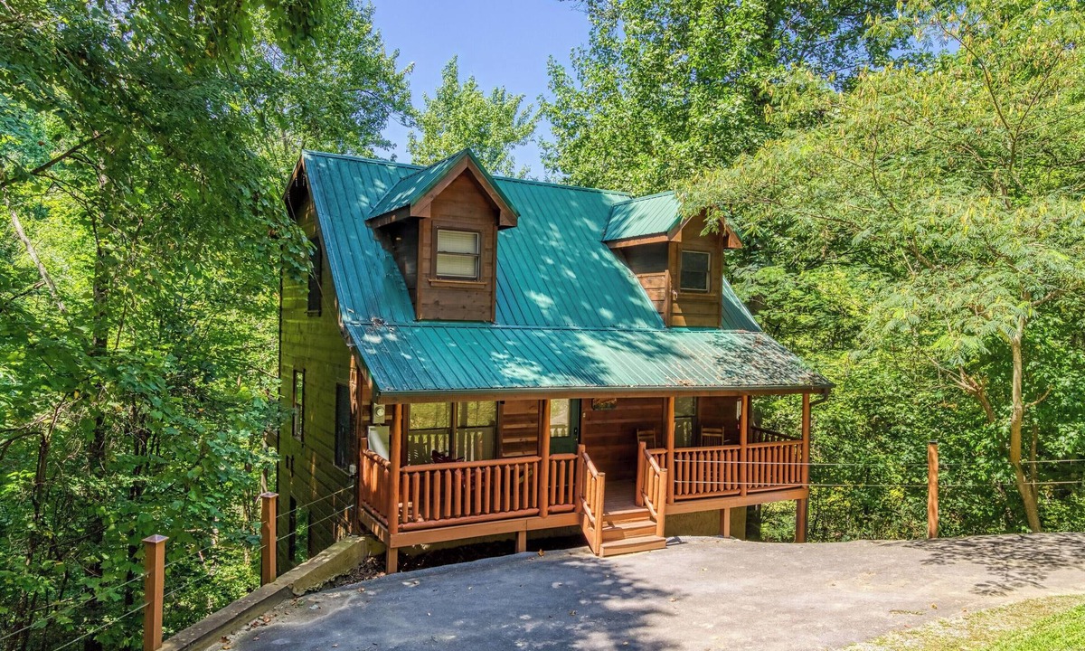 Sevierville Cabin | Private Wooded Setting! Theater Room! Centrally Located! 3 Decks! Fun Game Room