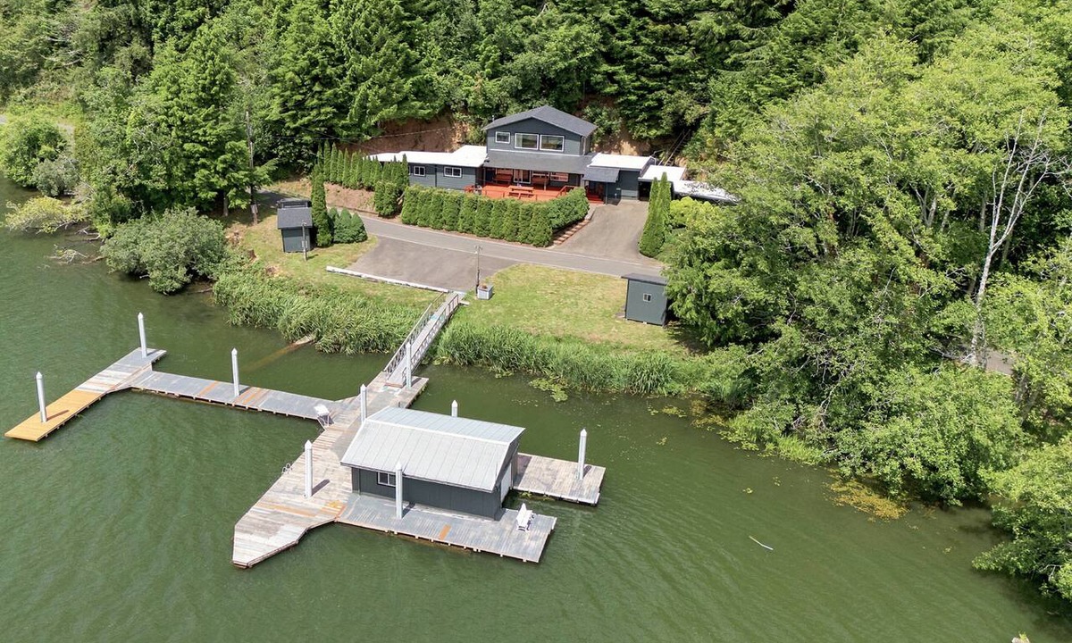 Westlake House | Tranquil Siltcoos Lakefront Gem w/Luxurious Master Suite with View, Dock, EV Charger