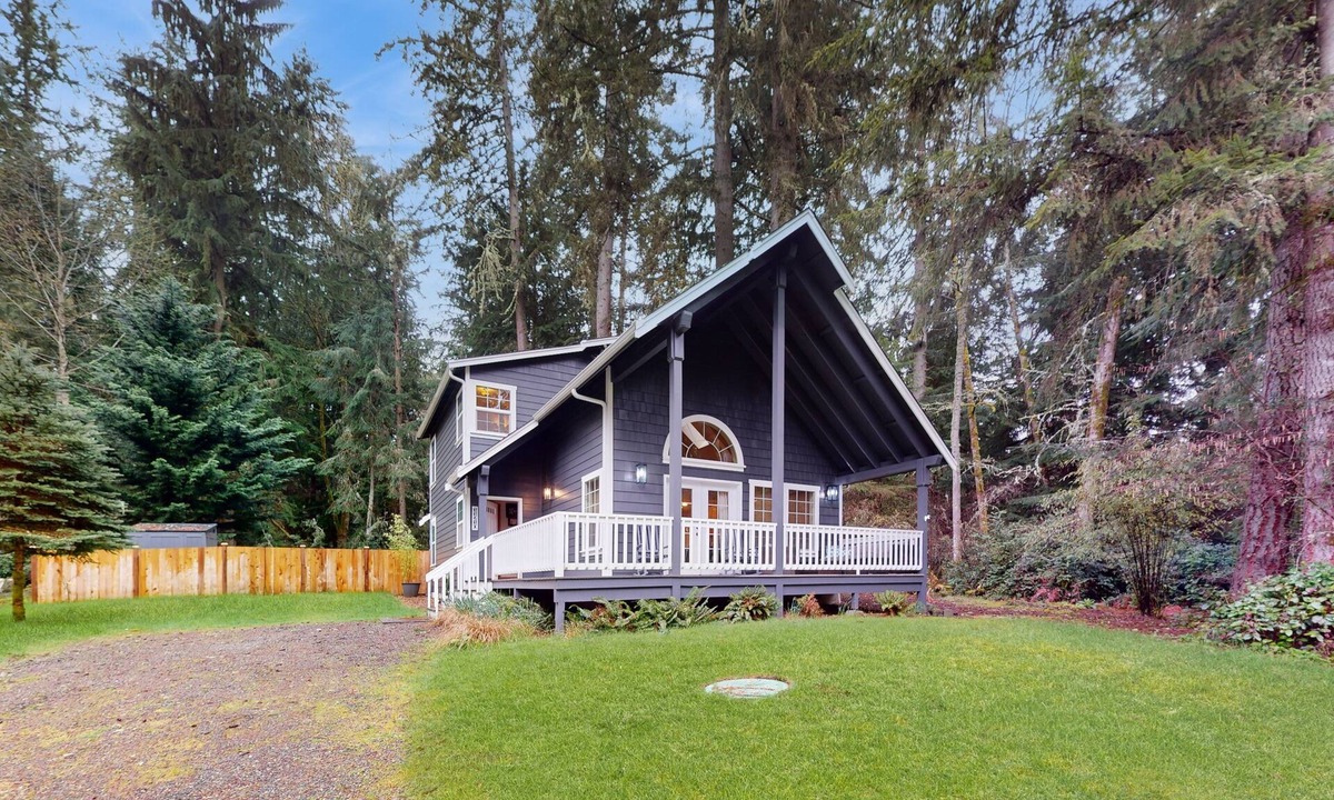 Anderson Island House | Tree-lined Anderson Island home with porch & fenced yard, near dock/tennis