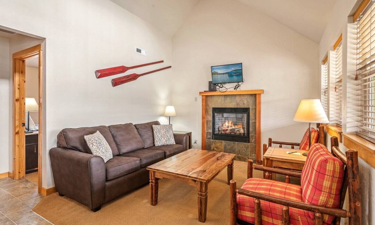 Dover Bay House | Unwind at Fish Tales Bungalow, a charming coastal-style hideaway just steps from the lake. Enjoy resort amenities, trails, and the tranquil Dover Bay setting.
