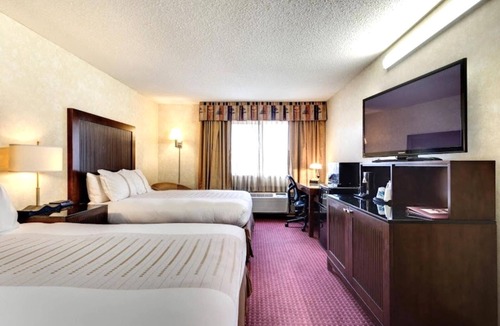 Devils Lake Hotel | 2 Queen Bed Suite near Ruger Park | Free Parking & Year-Round Indoor Pool!