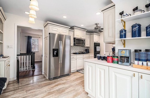 West Omaha House | A Touch of Luxury - Arcade, 5 TVs, Bounce House, Coffee Bar