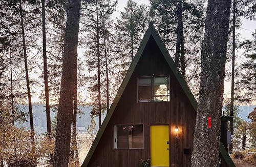 Hayden Lake Cabin | All day sun! Lakefront A-Frame cabin, private dock, sunset views, pet friendly.