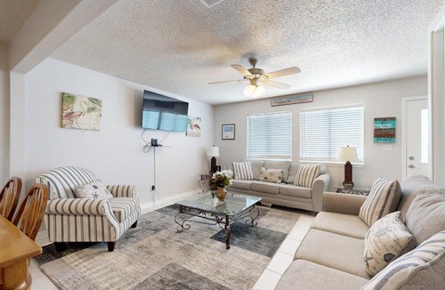Sugar Beach House | Beachfront townhome with on-site beach access heated pool patio grill AC WD