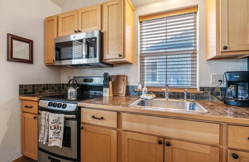 Dover Bay House | Bright, breezy, and close to the shoreline, "Beach Attitude" captures lakeside fun and easy resort living all year long!