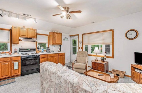 Lakeside House | Charming home with sunroom, large yard, full kitchen, & washer/dryer
