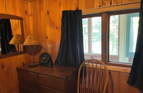 Lac La Belle Cabin | Charming Resort Cabin Steps from the Water and Campfire Evenings