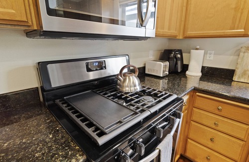 Medford House | Charming white picket fenced home in quiet area
