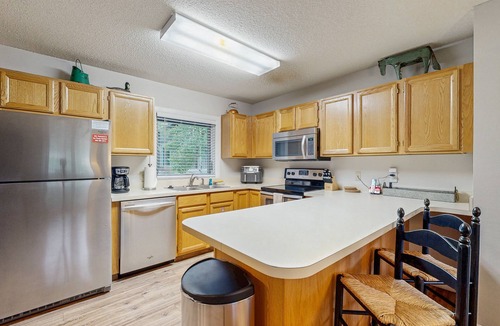 Big Horn Condo | Comfortable Big Sky condo with deck, W/D & WiFi - across the street from lift