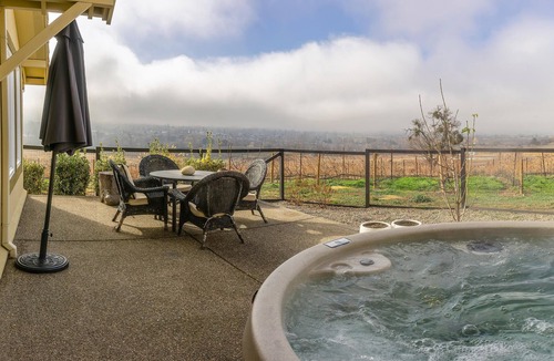 Talent Apartment | Cottage offers a sectional sofa, chef's kitchen and open floor plan.
