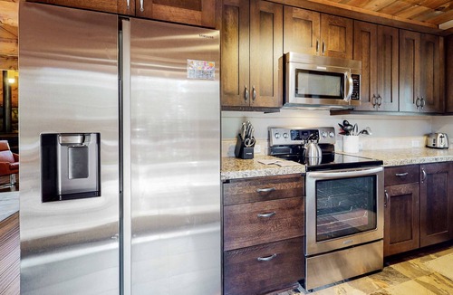 River Forest Acres Cabin | Cozy & colorful retreat with a deck, grill, wood stove, board games, W&D, & AC
