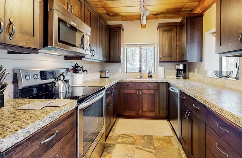 River Forest Acres Cabin | Cozy & colorful retreat with a deck, grill, wood stove, board games, W&D, & AC
