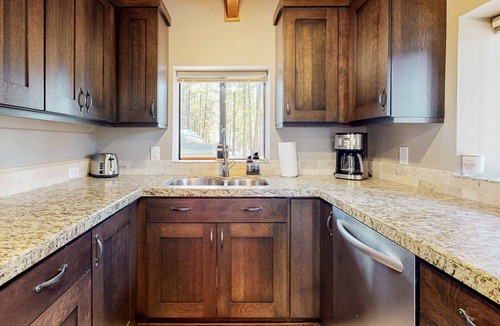 River Forest Acres Cabin | Cozy & colorful retreat with a deck, grill, wood stove, board games, W&D, & AC