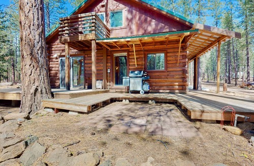 River Forest Acres Cabin | Cozy & colorful retreat with a deck, grill, wood stove, board games, W&D, & AC