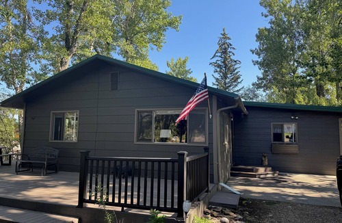 Red Lodge Cabin | Cozy Getaway in Town! Enjoy Rock Creek Flowing Just Steps from Wrap Round Deck