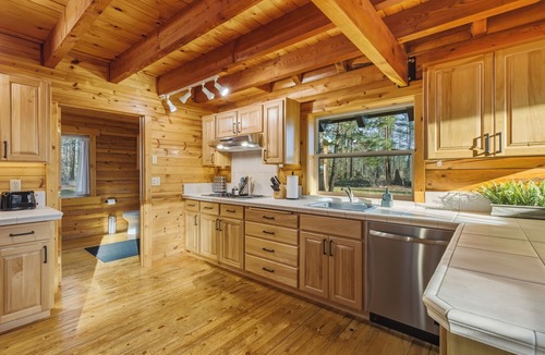 Nine Mile Falls Cabin | Cozy Log Cabin Retreat INSIDE Riverside State Park located directly on trail 25!