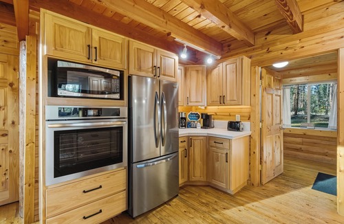 Nine Mile Falls Cabin | Cozy Log Cabin Retreat INSIDE Riverside State Park located directly on trail 25!