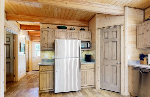 Dixie House | Dog-friendly riverfront home near town with deck, water views, & fireplace