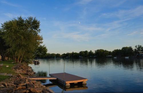Moline House | Eclectic Riverside Home 3 Season Room Large Deck