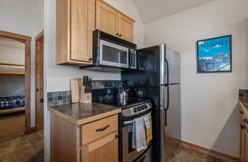 Dover Bay House | Embrace lakeside serenity at this cozy Dover Bay bungalow, just steps from the water, perfect for couples or families seeking peaceful Idaho charm.