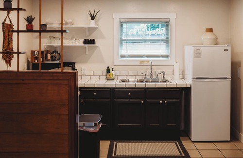 Phoenix House | Escape to this artsy 2-bedroom MCM Guesthouse in charming Phoenix, OR. Unwind in the luxurious spa soaking tub after exploring Southern Oregon. Features high-end design for a stylish, quiet retreat.