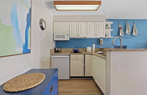 Charlevoix Condo | EWI 117A Waterfront Access | Pool, Hot Tub, Sauna | Sleeps 4