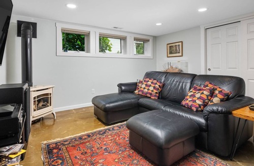 Hosford-Abernethy Condo | Exceptional Daylight Basement Location, Private Entrance, Cozy Patio Area w/ BBQ, Close 2 Everything