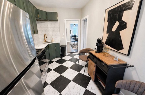 Lakeview Apartment | Gothic-meets-mid-century 2BR in Lakeview | Statment Kitchen + Dining for 4