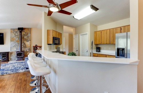Three Rivers House | Incredible Riverside Home, River Views and Access, Huge Deck, Bikes, Close to Golf, Courts, and Pool