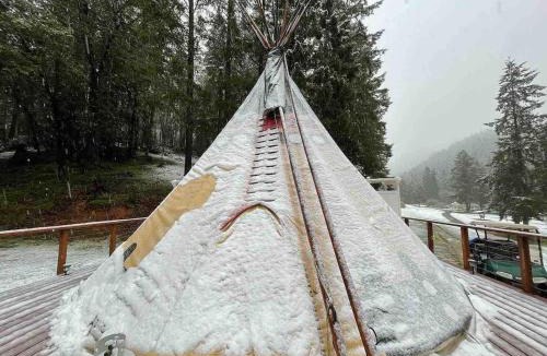 Leland Other | Indulge in the ultimate Glamping experience with our Luxury Tipi packages featuring four unique sites with private decks, indoor and outdoor fire pits, and exclusive access to 155 acres of private hiking trails
