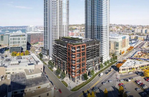 South Lake Union House | Level Seattle- Enjoy city views in our studio suite with one king bed, furnished kitchen and a deluxe bathroom.