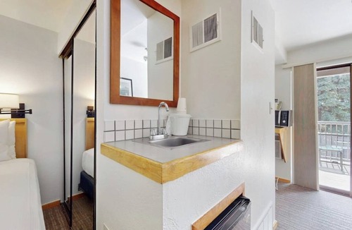 West End Cabin | Main St. studio - pool & hot tub - walk to lifts, dog-friendly, private balcony