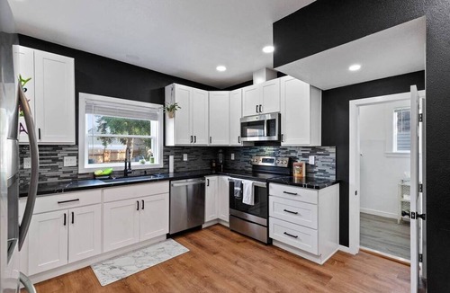 West Central House | Modern 2BR/2BA retreat for 6 with hot tub & stocked kitchen.
