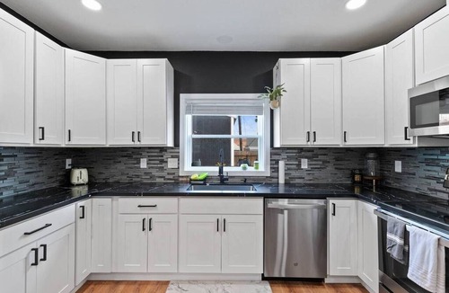 West Central House | Modern 2BR/2BA retreat for 6 with hot tub & stocked kitchen.
