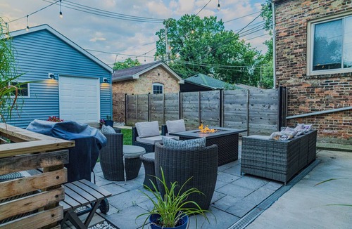 Logan Square Apartment | Modern 3-Bed Stay w/Patio, Firepit, & Garage Parking Spot