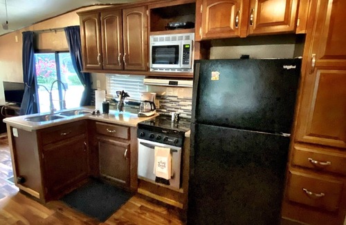 Milton RV Rental | Nice 40’ RV with all modern conveniences, (full kitchen, bathroom, separate bedroom), in private Resort/campground, pool, hot tub, sauna, clubhouse available to all guests.
