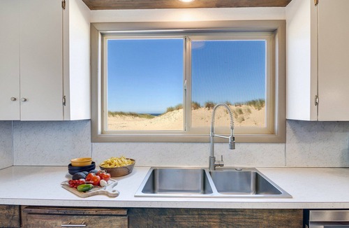 Bayshore House | Ocean Front House Sits Right on a Sandy Beach!