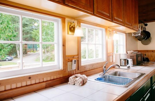 Olga Cottage | Old Island Charm with Stunning Mountain Views, Perched above Our Private Beach