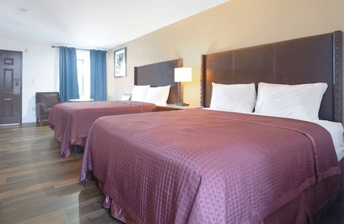 San Augustine Hotel | OYO Value: 2 Full Beds Non-Smoking, Great Location.