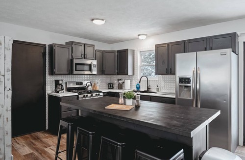 Grawn House | Pet-friendly home with fenced-in yard and hot tub