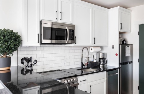 Bellaire Apartment | Pet-Friendly Studio in New Boutique Resort w/Hot Tubs, Sauna, Fire Pit, & More!