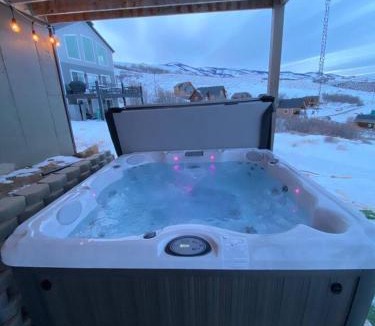 Harbor Village House | Putting green with hot tub, swings and spectacular views