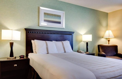 Devils Lake Hotel | Queen Bed Suite near Roosevelt Park | Free Parking & Year-Round Pool Access!