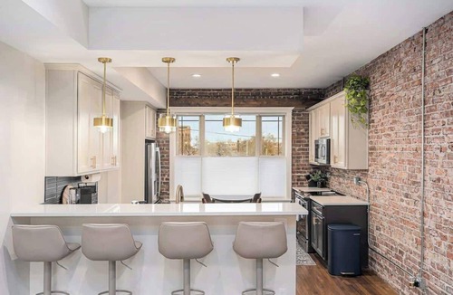 Downtown Omaha House | Rare Omaha Brownstone Retreat! 2 Kings and Garage!