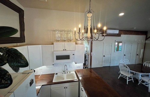 Nampa House | Red Roof Farmhouse large gathering space sleeps 27+ hot tub treehouse