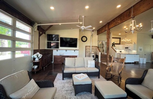 Nampa House | Red Roof Farmhouse large gathering space sleeps 27+ hot tub treehouse