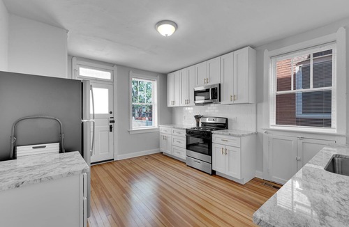 Benton Park Apartment | Relax on a private balcony with queen bed fast WiFi and full kitchen