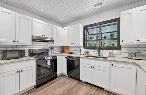 McCall House | Rio River Lodge- Riverfront home in McCall with sauna, hot tub, game room